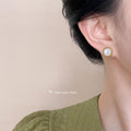 Gold Twisted Rope Round Shell Stud Earrings White Center view 2