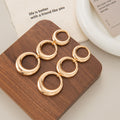 Gold Tone Triple Interlocking Ring Dangle Earrings view 4