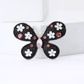 Floral Butterfly Brooch in Metal with Black Enamel Wings Dotted with Small Flowers view 4