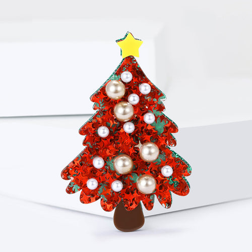 Close-up product view showing the colors and surface details of the red christmas tree brooch