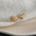 Gold Textured Heart Stud Earrings Faceted Dimple Metal Faces view 3