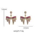 Gold Tone Crystal Pave Bow Drop Earrings Clear Colored Stones view 4