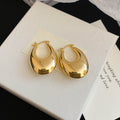 Textured and Polished Oval Hoop Earrings in Gold and Silver view 6