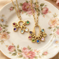 Gold Tone Chain Necklaces With Twelve Small Heart Birthstone Pendants view 1