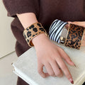 Wide Leopard Pattern Cuff Bracelet In Dark Or Light Brown With Gold Tone Edges view 1