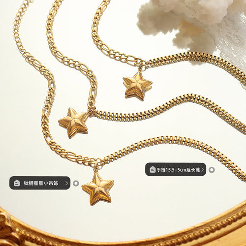 Gold star dual-chain bracelets on mirror with titanium length labels