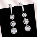 Triple Round Clear Stone Drop Earrings Metal Jewelry Design view 1
