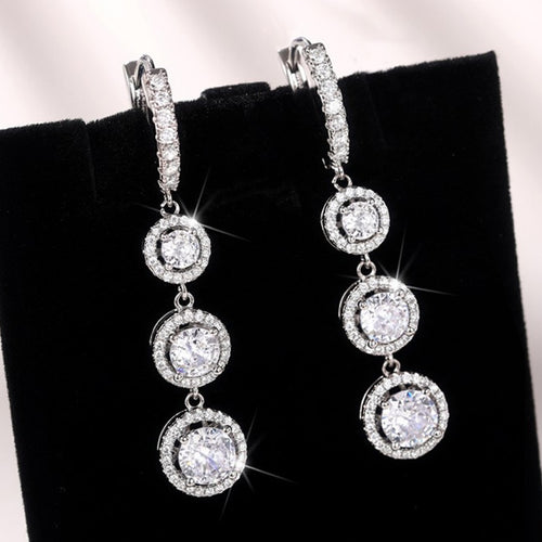 Triple Round Clear Stone Drop Earrings Metal Jewelry Design shown in a front close-up