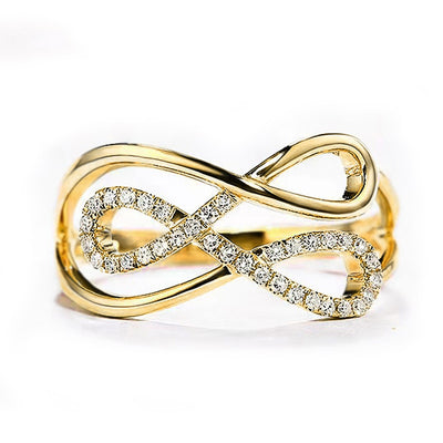 Front view of gold infinity cross pave openwork ring