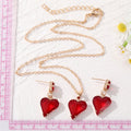 Gold Tone Red Faceted Crystal Heart Necklace and Earring Options view 2