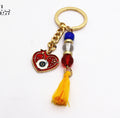 Gold Tone Red Evil Eye Heart Bead and Tassel Keychains view 5