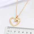 Gold Tone Open Heart and Horse Head Pendant Necklace with Curved Frame view 2