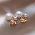 Asymmetric Gold Tone Rocking Horse And Pearl Stud Earrings view 1