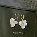 Gold Tone Translucent White Ruffled Flower Hook Earrings view 3