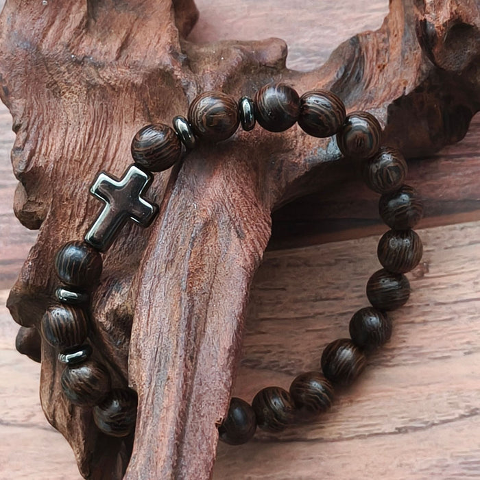 Dark Wood Bead Cross Stretch Bracelet with Silver Tone Spacers