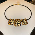 Gold Tone Three Plate Necklace With Small Black Flower Pattern view 6