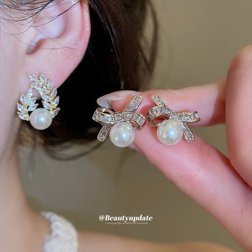 Styled view of crystal bow stud earrings with pearl drops in two styles