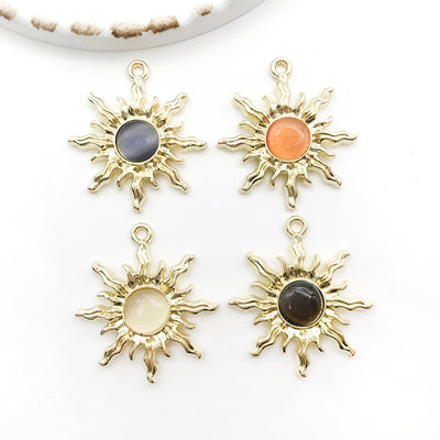 Colorful sun charms arranged on a light background