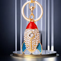 Jeweled Mini Rocket Keychain with Red Blue and White Enamel Details view 1