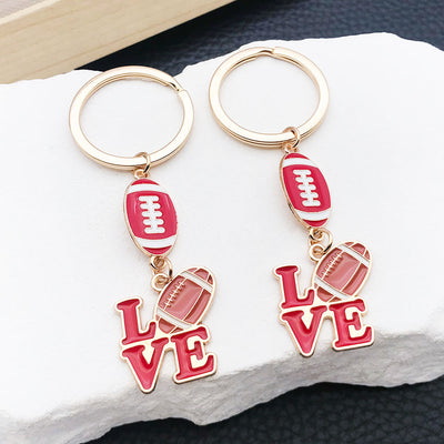 Main display of red or brown football and love letter keychains