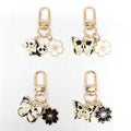Gold Tone Butterfly Skull and Cherry Blossom Clip Keychains view 2