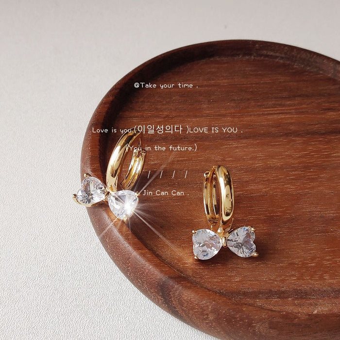 Gold-Tone Huggie Hoop Earrings Clear Crystal Bow Charms