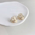Cream Enamel Geometric Knot Stud Earrings Gold Wire view 4