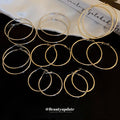Minimal Thin Round Hoop Earrings in Gold and Silver view 1