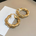 Gold Tone Textured Open Hoop Earrings with Polished Metal Finish view 3