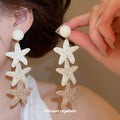 White and Beige Woven Starfish Cascade Stud Earrings view 1