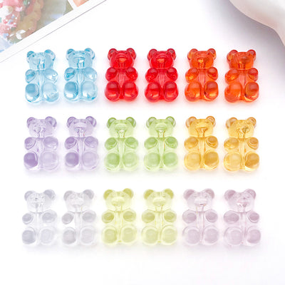 Clear bear charms arranged on a light background