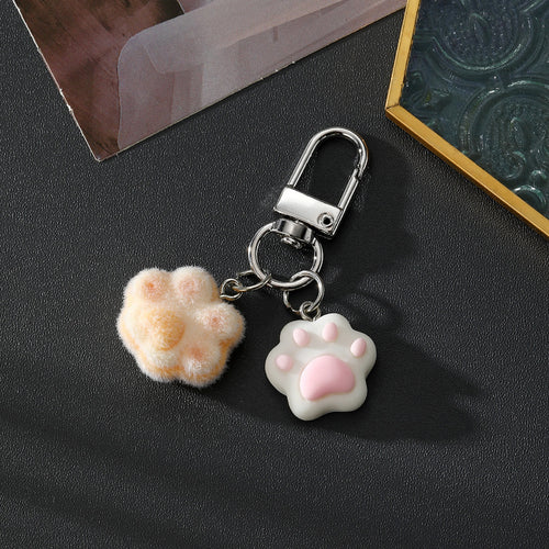 Peach flocked paw and white resin paw dual keychain with silver clasp
