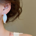 Cream Enamel Twisted Hoop Earrings with Gold Tone Edges view 4
