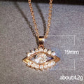 Gold Tone Evil Eye Pendant Necklace Clear Center Stone Halo view 5