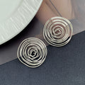 Gold and Silver Open Spiral Round Statement Stud Earrings view 6