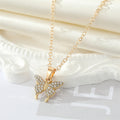 Gold Tone Crystal Butterfly Necklace and Huggie Earrings view 3