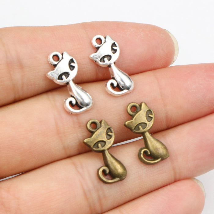 Sitting Cat Metal Charms with Cutout Details in Two Finishes