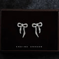 Silver Textured Ribbon Bow Stud Earrings Long Tail Pair view 1