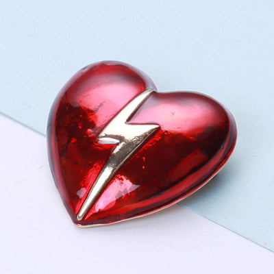 Front view of the lightning heart brooch and its color options