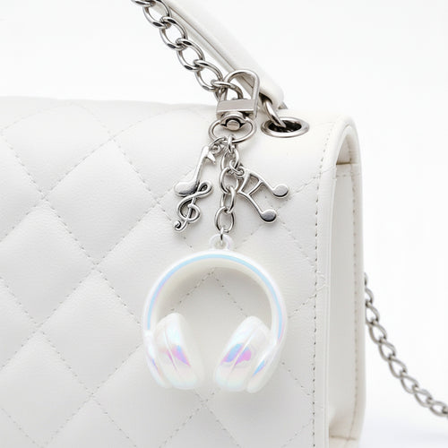 Front product photo of solid white headphone and music note clip keychain eight-color showing the pictured design arrang