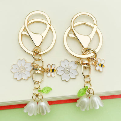 Image 1 showing bee and honeycomb keychains shown in the product image.