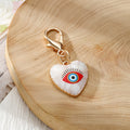 Gold Tone Evil Eye Heart Charms with Large Lobster Clasps in Six Designs view 5