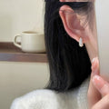 Silver Tone Clear Pave Curved Teardrop Huggie Earrings view 3