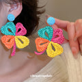 Woven Five Petal Flower Earrings With Polished Metal Tone Details view 3