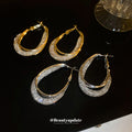 Textured Oval Hoop Earrings In Gold And Silver Tones view 2