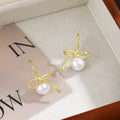 Gold Tone Bow White Pearl Look Ball Huggie Earrings view 2