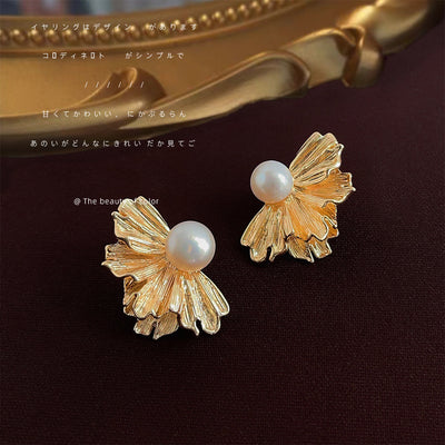 Gold fan petal pearl studs on dark red fabric gold frame
