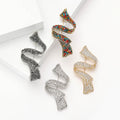 Crystal Wavy Ribbon Metal Brooch in a Gold Tone Finish view 1