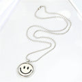 Silver Tone Reversible Smiley and Frown Spinner Pendant Necklaces view 1