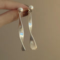 Matte Wavy Ribbon Drop Stud Earrings in Gold and Silver view 7